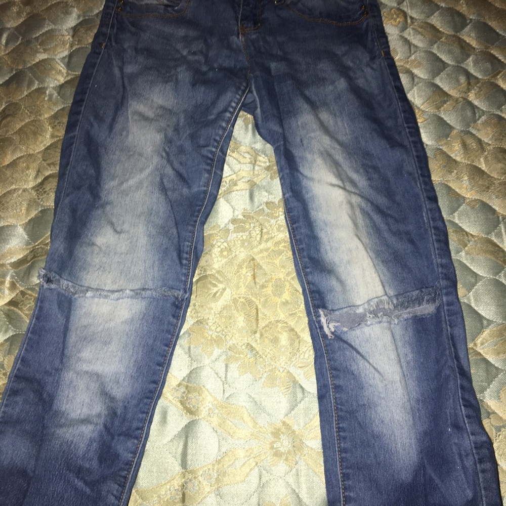 Blue jeans with ripped knees